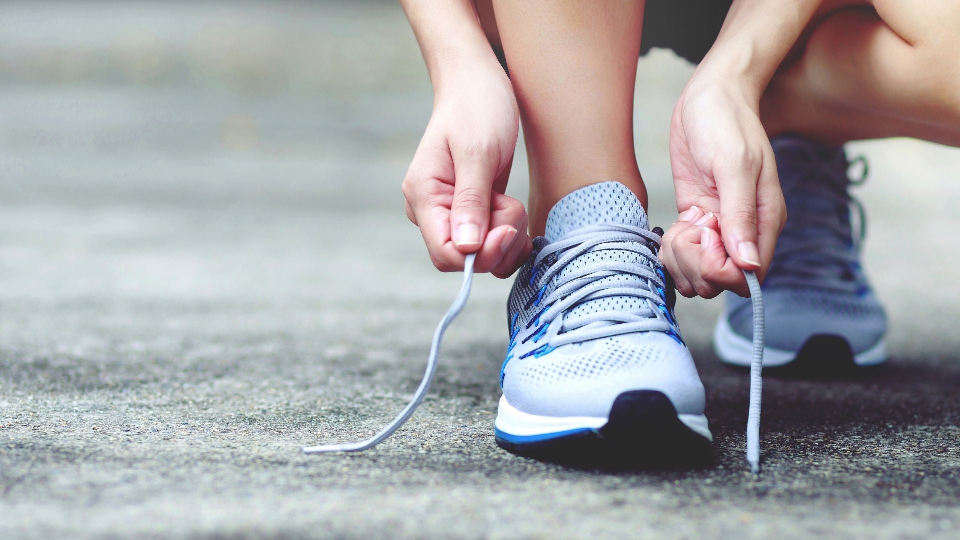 person tying shoes